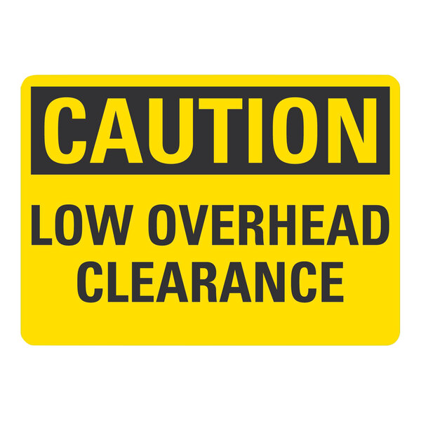A yellow and black rectangular aluminum sign that says "Caution / Low Overhead Clearance"