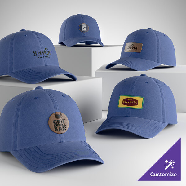 A collection of customizable faded blue 6-panel garment-washed dad caps with various logo designs.