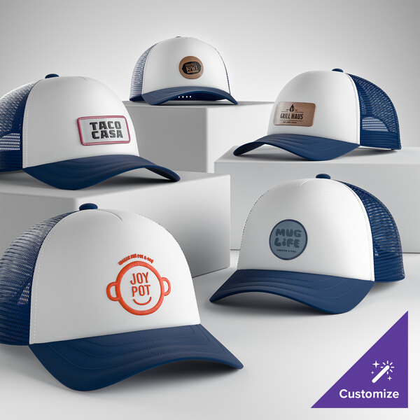 A group of customizable ivory and navy 5-panel foam trucker caps with mesh backs, displayed on white platforms.