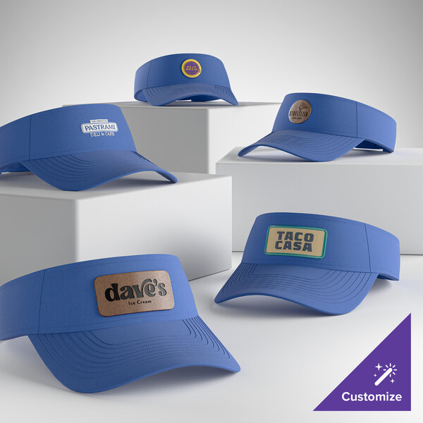 A collection of ultramarine blue visors with customizable front panels for branding or logos.