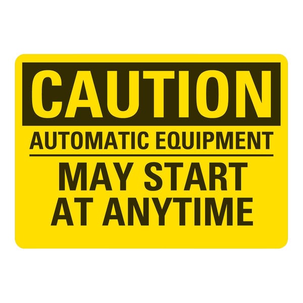 A yellow and black rectangular Lavex safety label with black text reading "Caution Automatic Equipment May Start At Anytime"