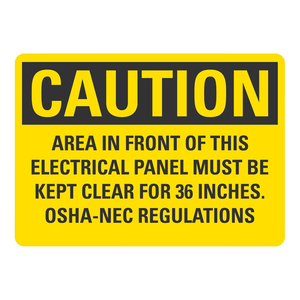 A yellow rectangular sign with black text reading "Caution / Area In Front Of This Electrical Panel Must Be Kept Clear For 36 Inches"