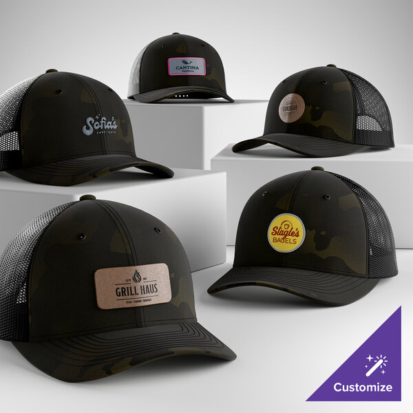 A collection of customizable black 6-panel trucker caps with mesh backs and various logo designs.