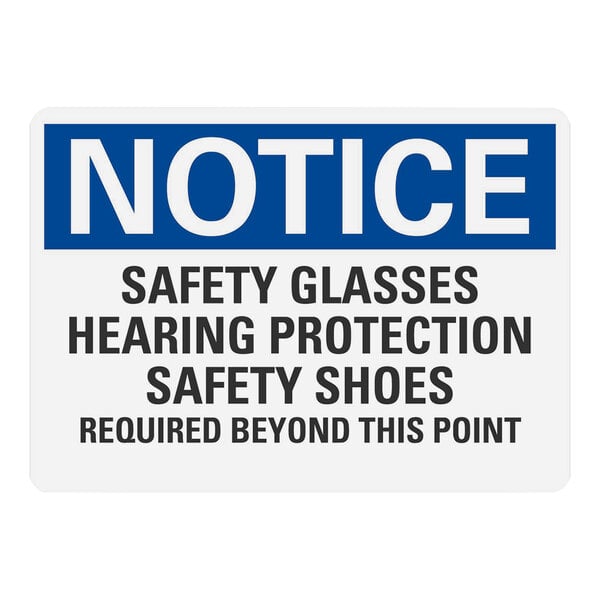 A white and blue sign that says "Notice Safety Glasses Hearing Protection Safety Shoes Required Beyond This Point" in white and black text.