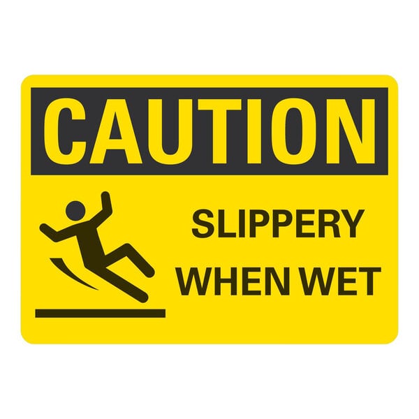 A yellow rectangular Lavex safety label with black text reading "Caution Slippery When Wet" and a person falling.