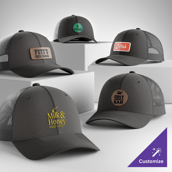 A collection of customizable grey steel 6-panel trucker caps with mesh backs and various logo designs.