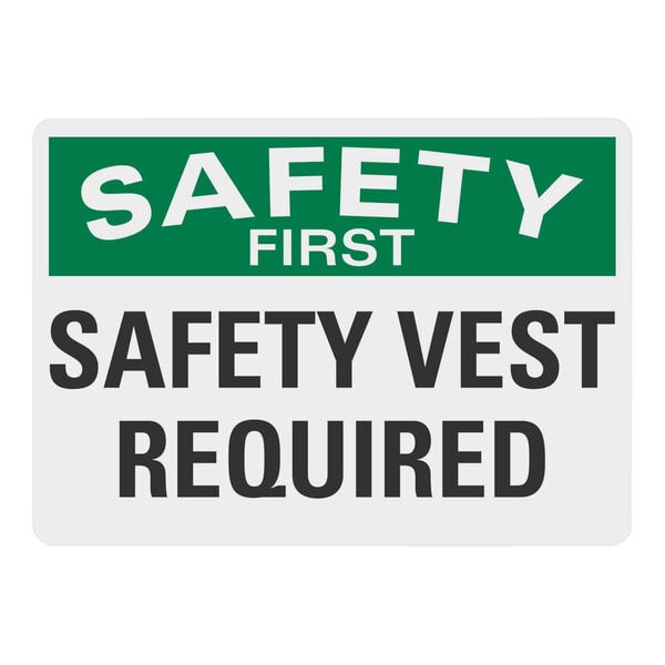 A white non-reflective plastic sign with the words "Safety First / Safety Vest Required" in white letters.