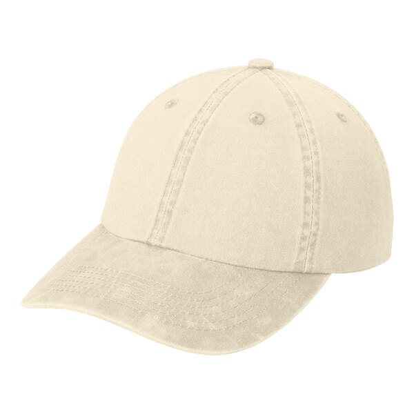 A beige Port Authority dad cap with a low profile and unstructured design.