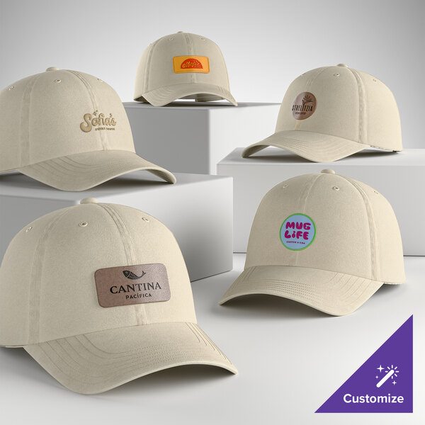 A collection of customizable stone-colored, unstructured, low-profile 6-panel dad caps with various logo designs.