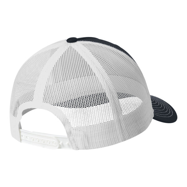 A white trucker cap with navy and white dots on the front and a white mesh back.