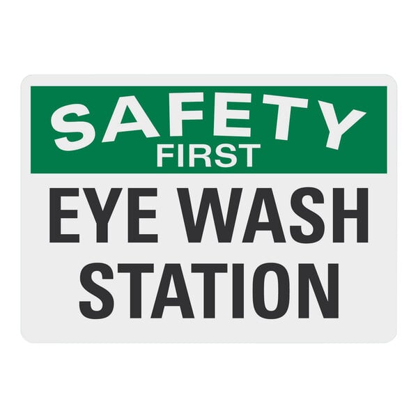 A white rectangular Lavex aluminum sign with the words "Safety First" in black and "Eye Wash Station" in white on a green background.