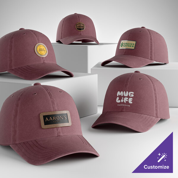 A collection of customizable maroon 6-panel garment-washed dad caps with various logo designs.