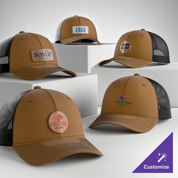 A collection of customizable brown and black 6-panel trucker caps with mesh backs displayed on white platforms.