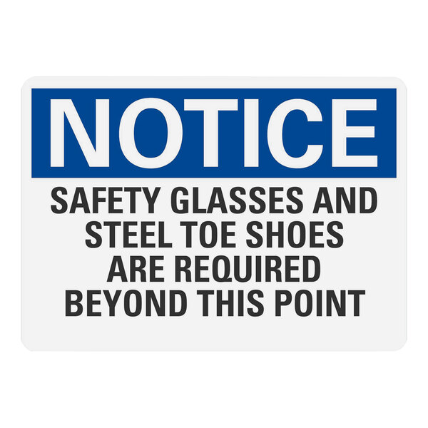 A blue and white Lavex safety label with white text that says "Notice Safety Glasses And Steel Toe Shoes Are Required Beyond This Point"