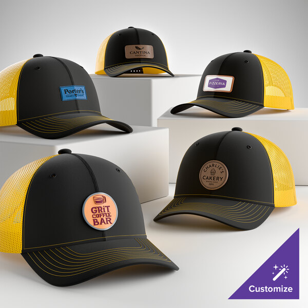 A collection of customizable black and gold 6-panel trucker caps with mesh backs and various business logos on the front.