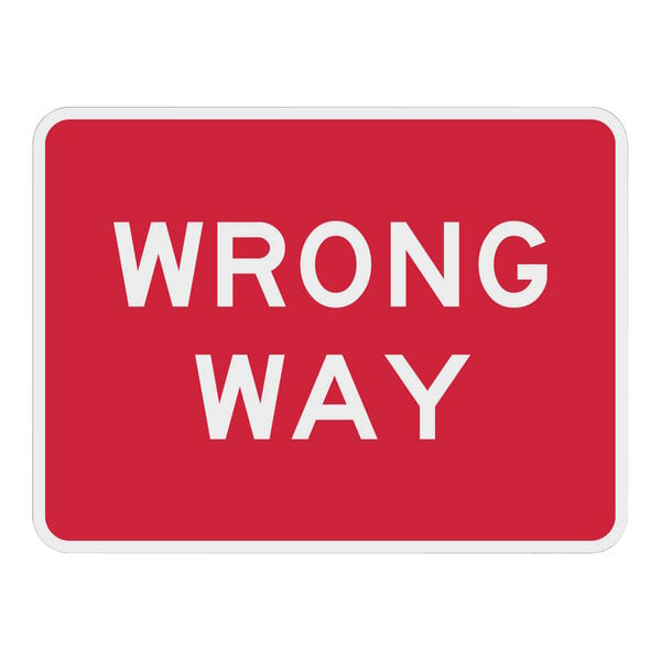 A red and white Lavex engineer-grade reflective aluminum "Wrong Way" sign.