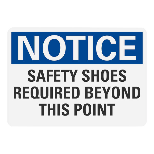 A blue Lavex aluminum safety sign with white lettering that says "Notice Safety Shoes Required Beyond This Point"