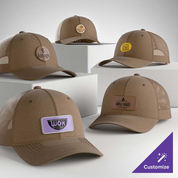 A collection of customizable woodland brown 6-panel trucker caps with mesh backs and various logo patches displayed on a white background.