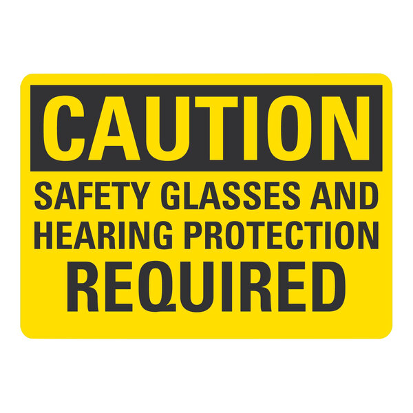 A yellow and black plastic safety sign that reads "Caution / Safety Glasses And Hearing Protection Required"