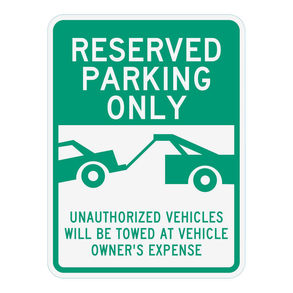 A white sign with green and white text reading "Reserved Parking Only / Unauthorized Vehicles Will Be Towed Away At Vehicle Owner's Expense"