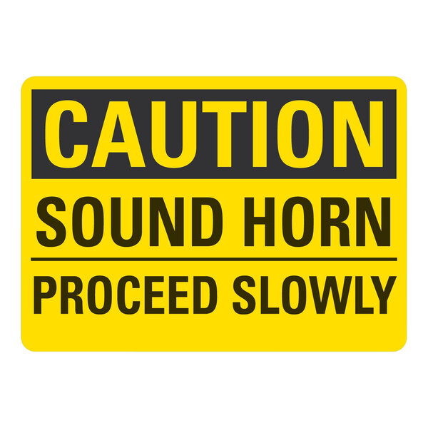 A yellow and black Lavex safety sign that says "Caution / Sound Horn / Proceed Slowly" in black text.