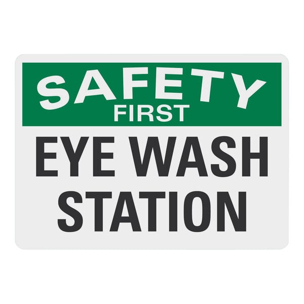 A white rectangular Lavex adhesive vinyl sign with green and white text reading "Safety First / Eye Wash Station"