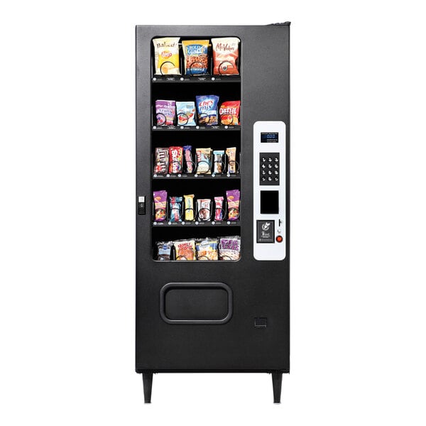 A VEND MACH vending machine with snacks on shelves.