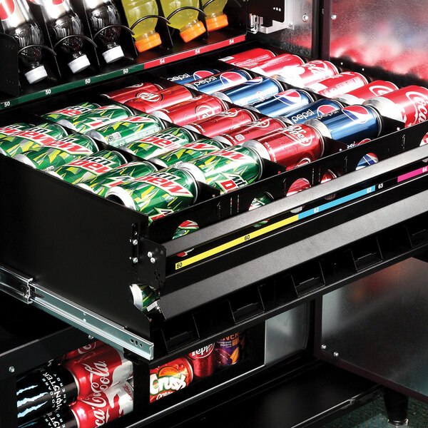A VEND MACH 29 SLT COMBO MECH & VAL vending machine with a variety of soda cans inside.