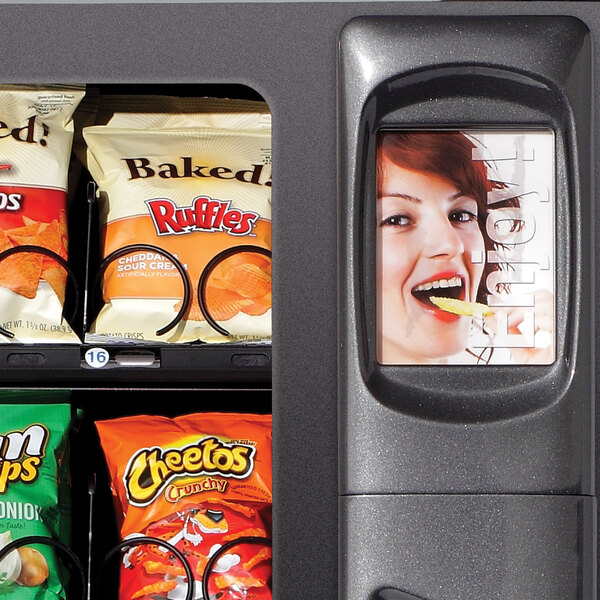 A vending machine with snacks and chips in it.