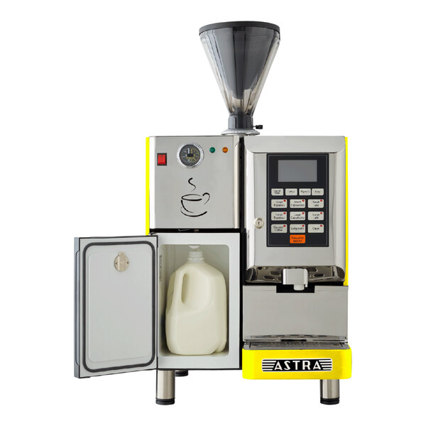 A yellow Astra Super Mega I automatic coffee machine with a jug of milk inside.