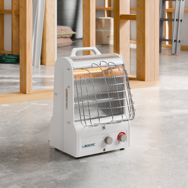 A portable electric radiant and forced air heater with a protective grill and control knobs, labeled 'Boltic'.