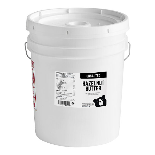 A white bucket of Bare Nut Butter Unsalted Hazelnut Butter with a label.