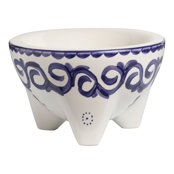 A white bowl with blue designs.