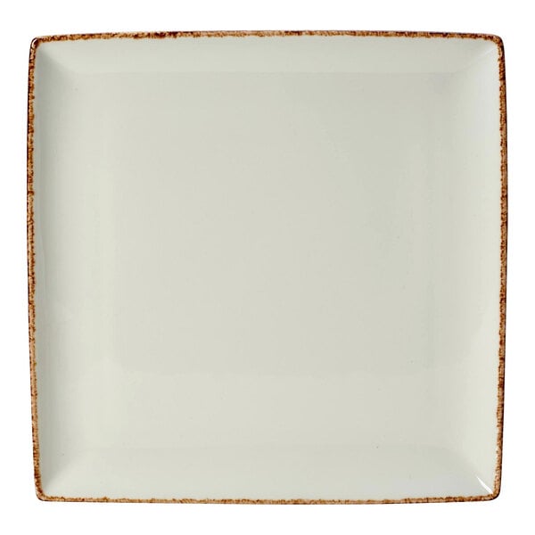 A white square porcelain tray with brown speckled edges.