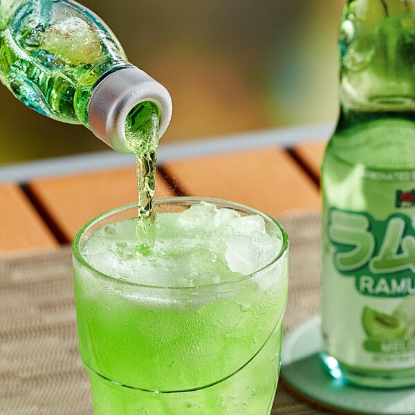 Hana Ramune Melon Soda being poured into a glass.