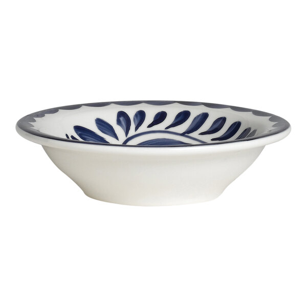 A white bowl with blue painted designs.