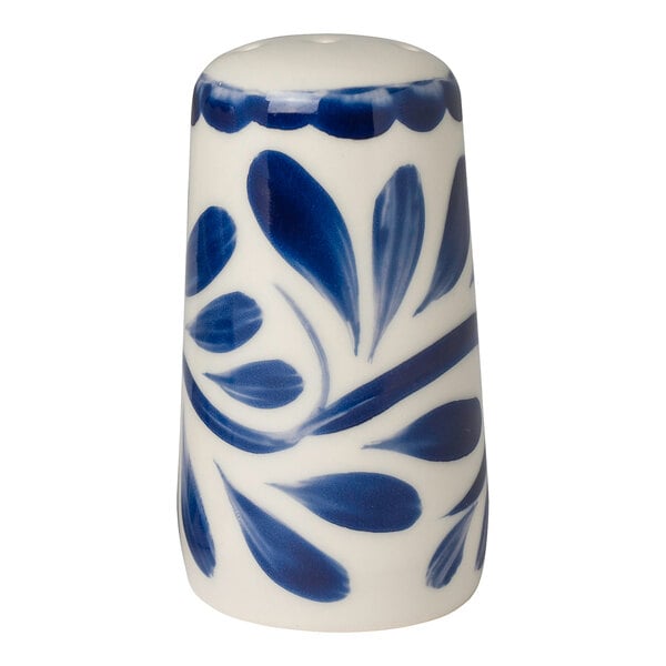 A blue and white Anfora pepper shaker with a leaf design.