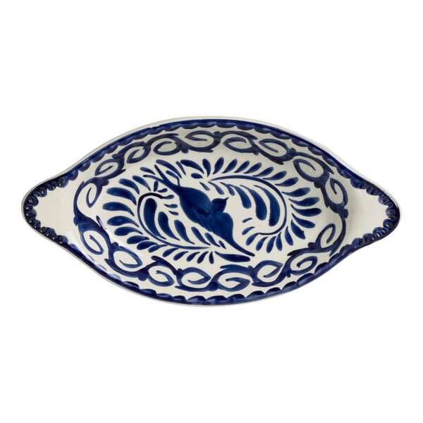 A blue and white oval rarebit dish with a bird design.