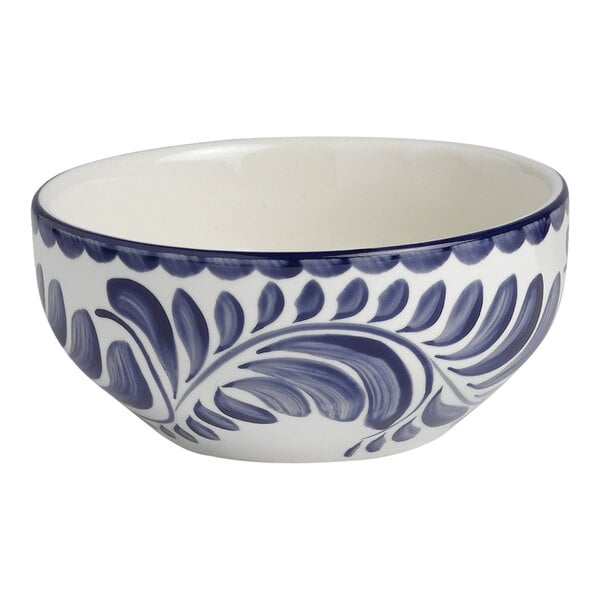 A white porcelain Anfora oatmeal bowl with blue and white designs.