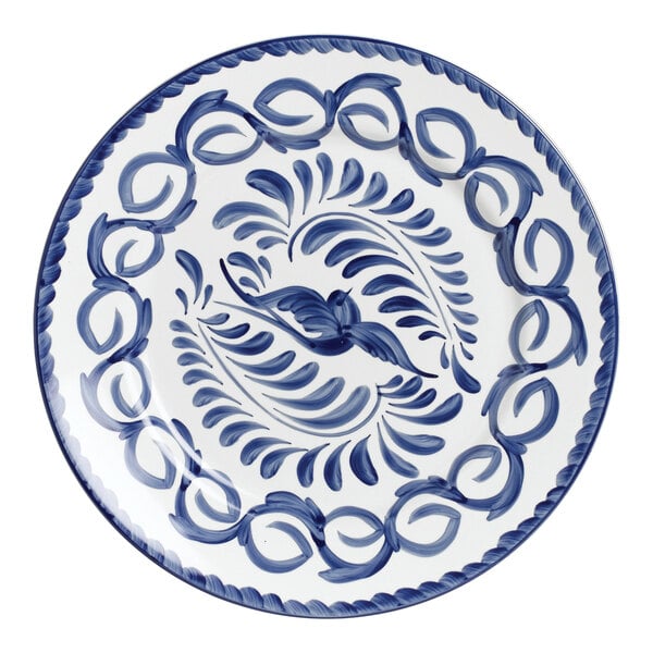 A blue and white Anfora Puebla porcelain chop plate with a bird design.