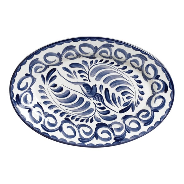 An Anfora Blue Puebla oval platter with a blue and white design.