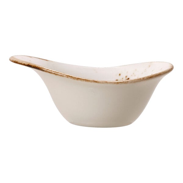 A close-up of a white Steelite Performance Craft FreeStyle bowl with brown speckles.