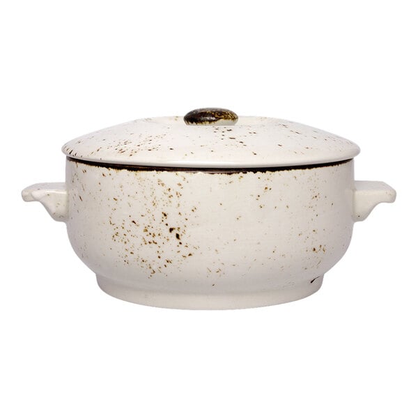 A white ceramic soup bowl with a handle.