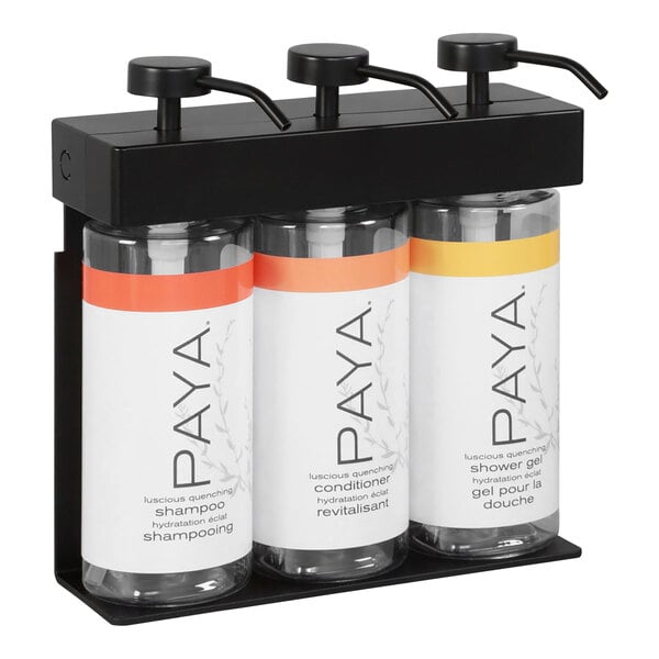 A black wall-mounted dispenser with three oval bottles labeled Paya.