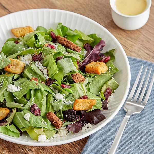 A bowl of fresh sorrel with croutons.