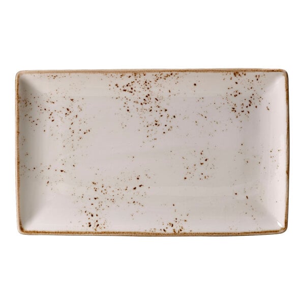 A white rectangular tray with brown specks on it.