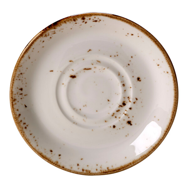 A Steelite Performance Craft white saucer with brown speckled edges.