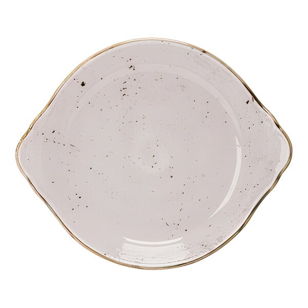 A white Steelite Performance Craft round eared dish with gold trim and black specks.