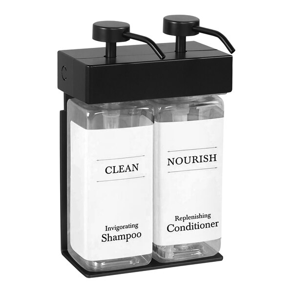 A black and white Dispenser Amenities wall-mounted shower dispenser with two rectangular white bottles inside.