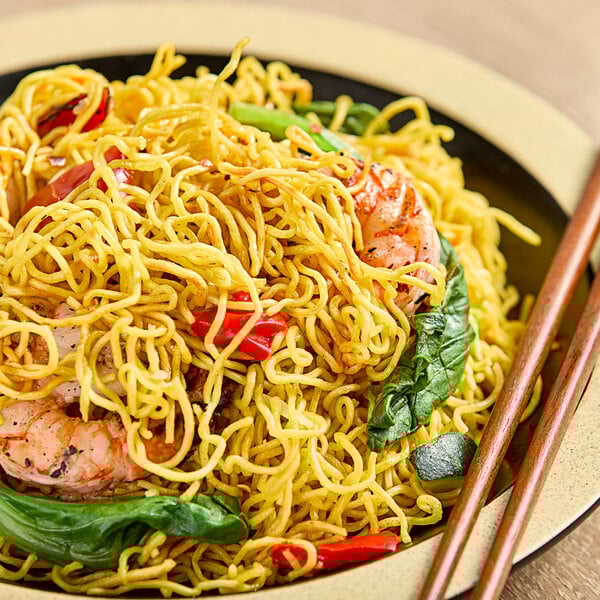 A bowl of Twin Marquis pre-cooked frozen ramen noodles with shrimp and vegetables.